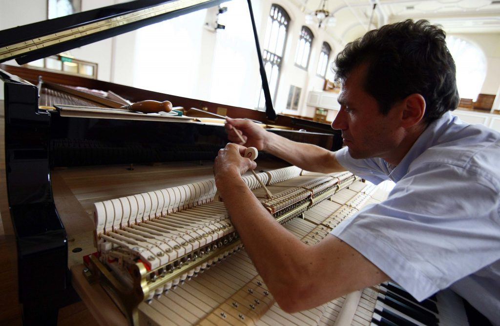 Piano tuner at work